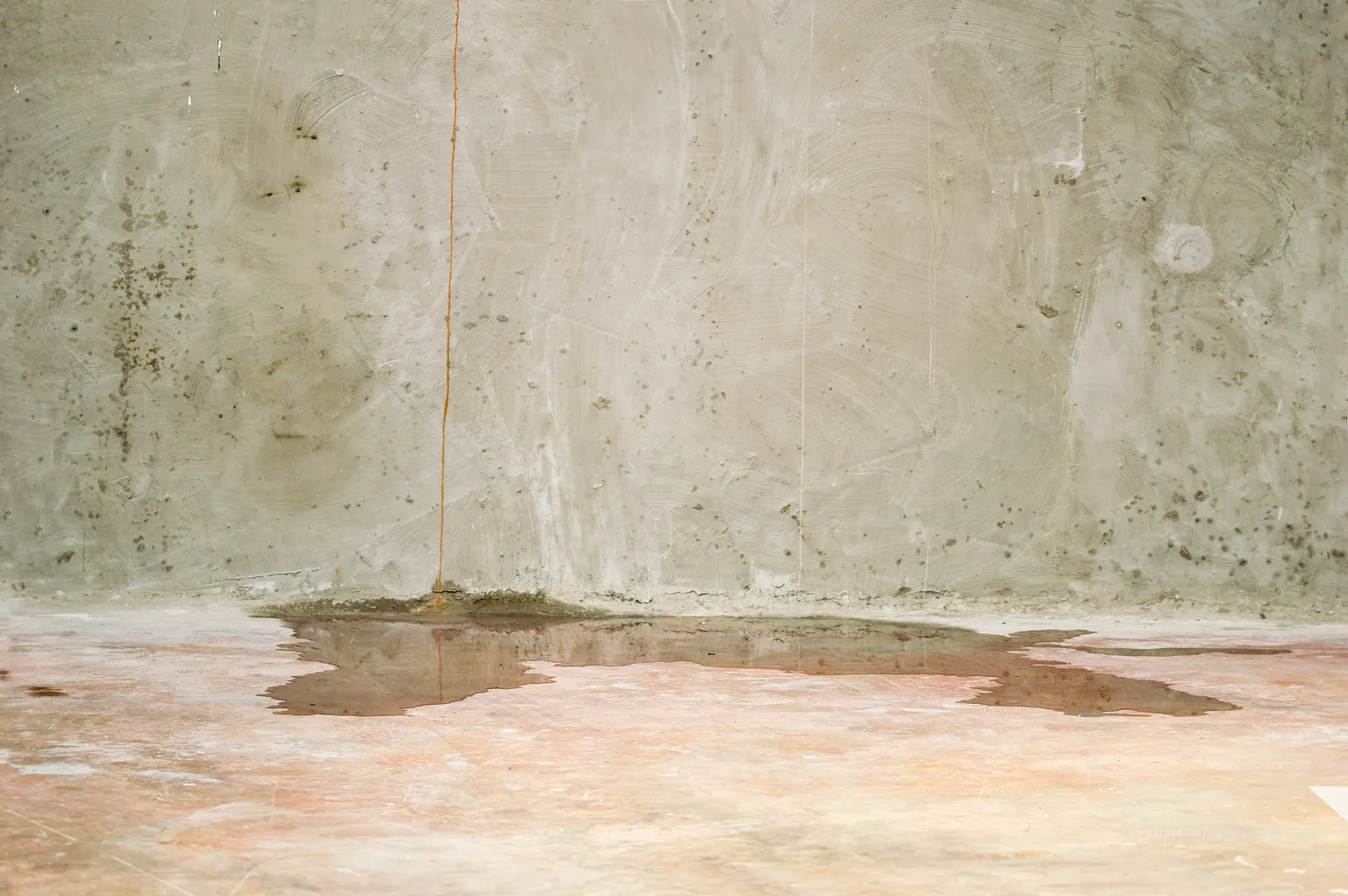 Illustration of storm water backing up into a home's lower level, the flood-event failure Beaumont's storm seasons make real