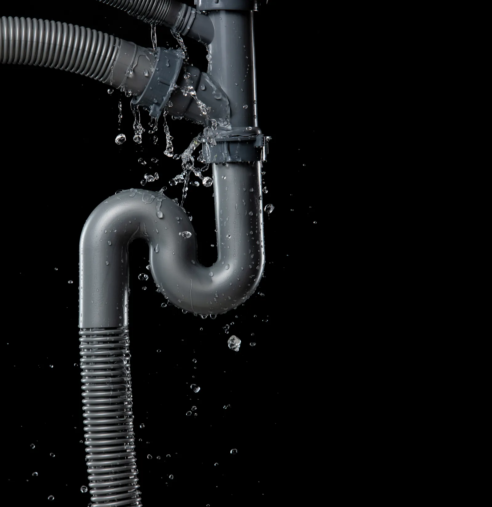 Water leaking from a failed pipe joint under a sink, the kind of surprise a PCS move-in inspection is designed to catch in Schertz
